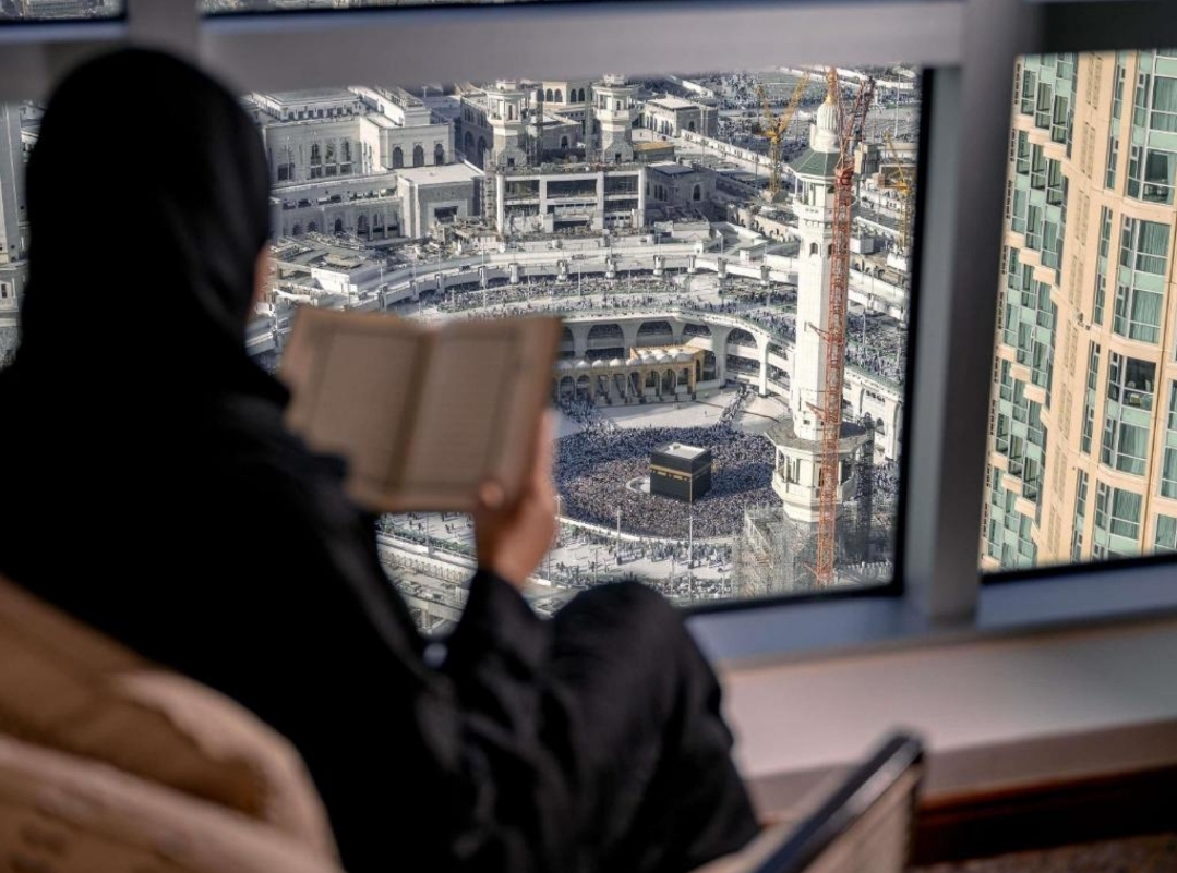 Haji sahib is reciting the quran facing the kaaba from the clock tower